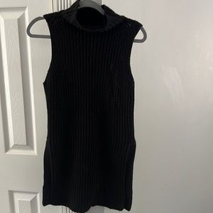 Sleeveless black sweater.